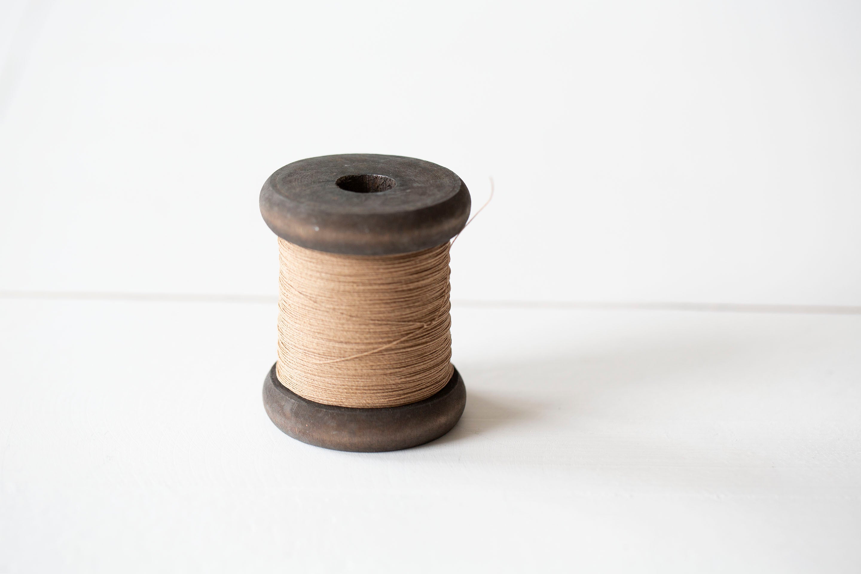 Finest Paper Yarn on New Stained Wooden Bobbin: Small